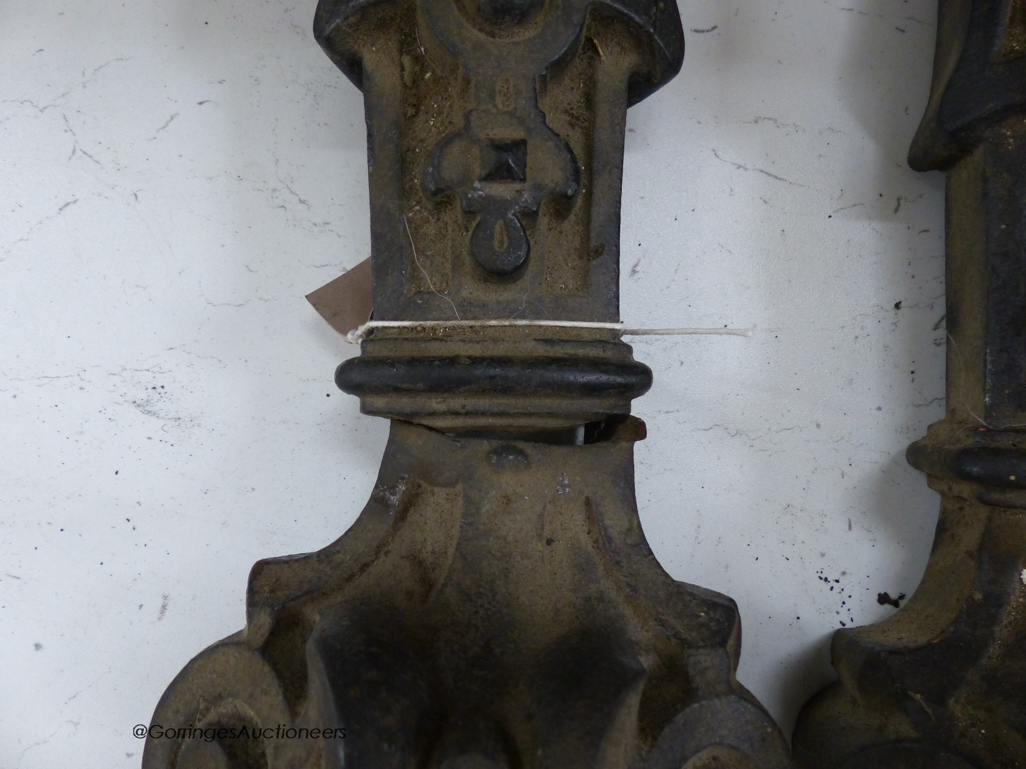 A pair of cast iron ‘lion’ monopodia mounts, 52cm high